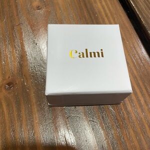 Gold calmi ring. New in package.  Magnetic therapy ring.